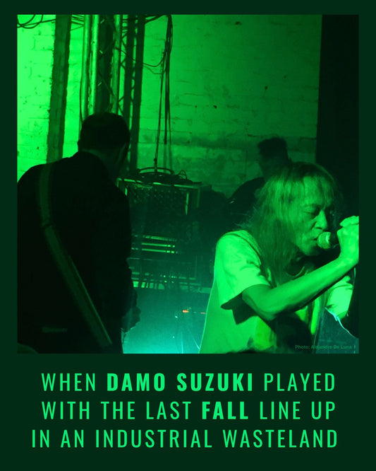 Damo Suzuki singing in green light with Imperial Wax, the last line up of The Fall, at The White Hotel, Salford, 2018